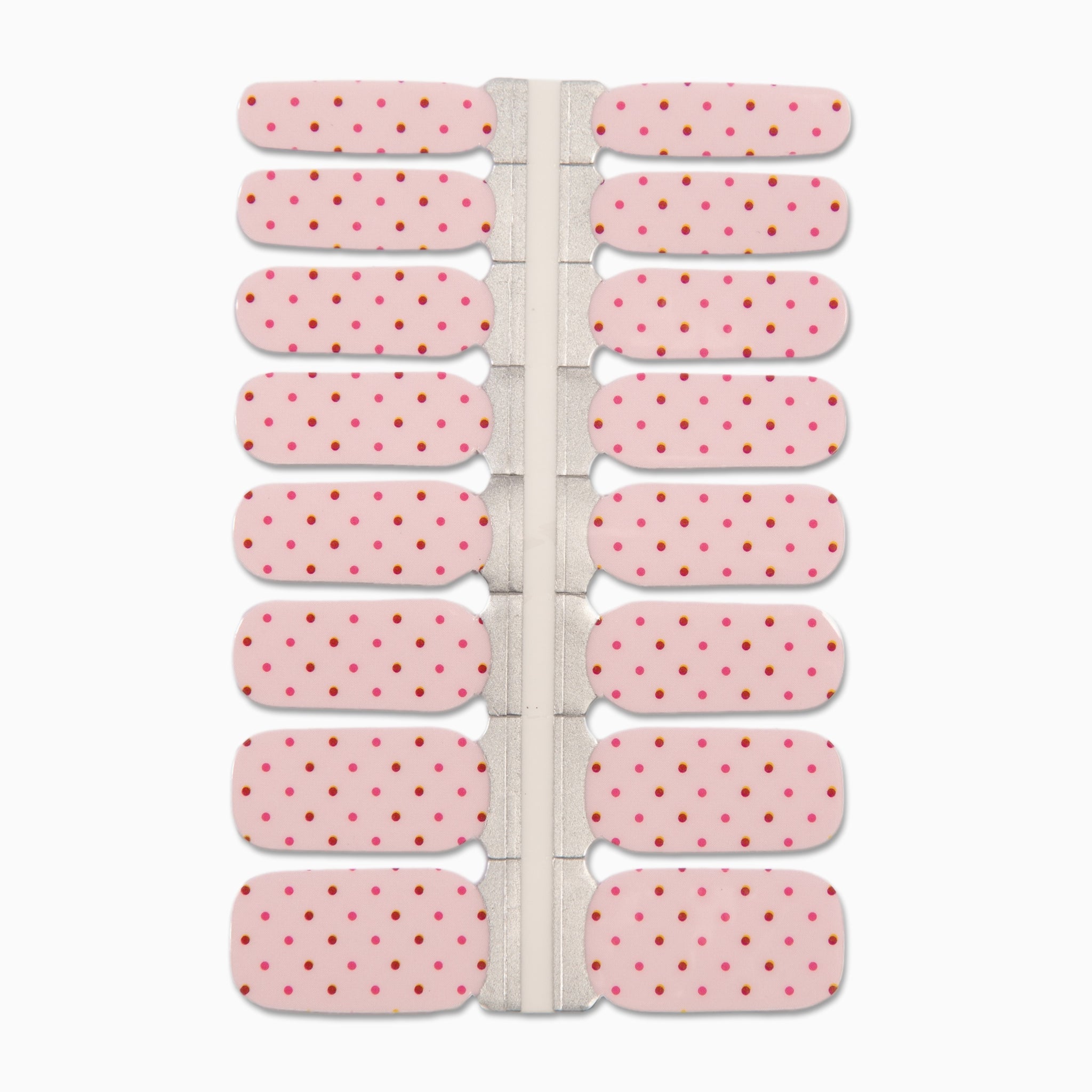 Lichtroze nagelstickers met rode en roze stipjes op witte achtergrond