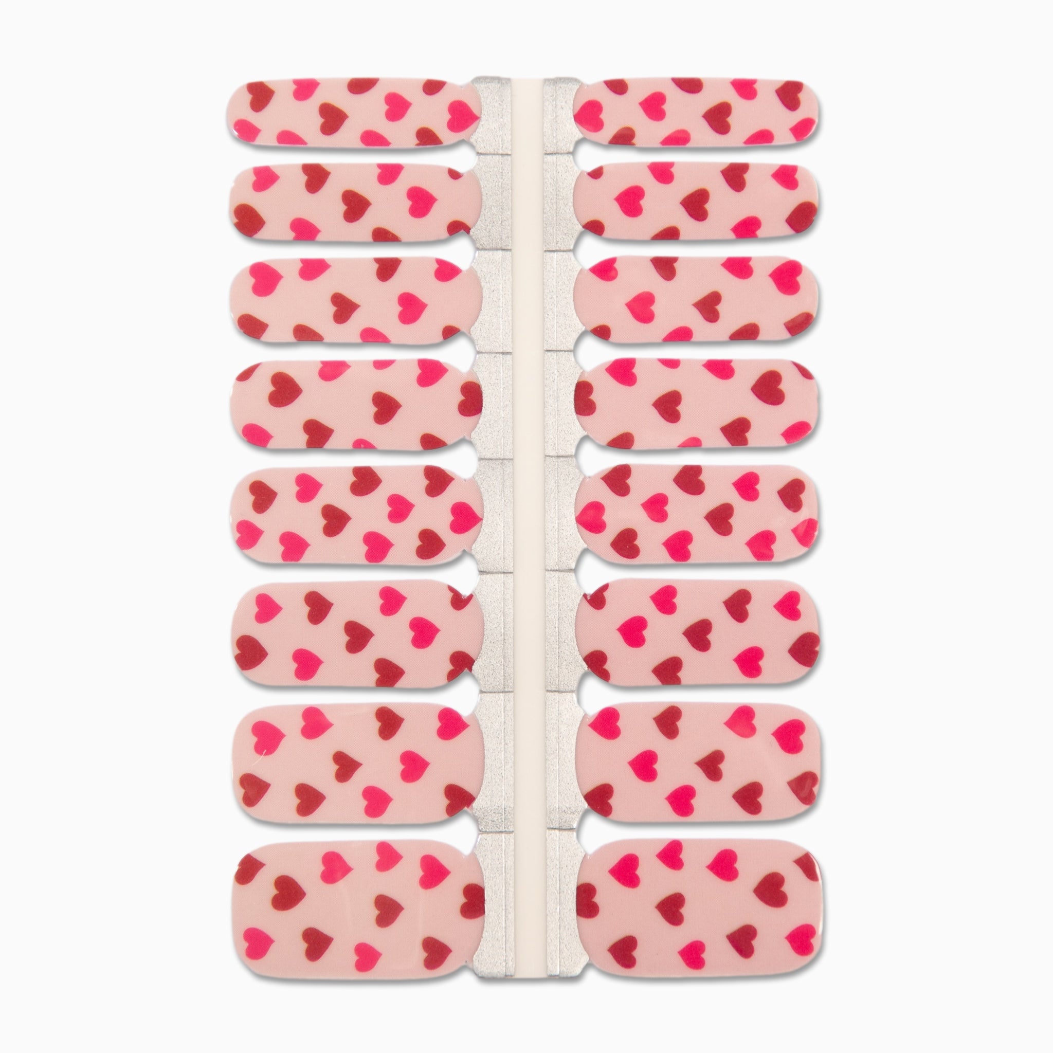 Lichtroze nagelstickers met rode en roze hartjes op witte achtergrond