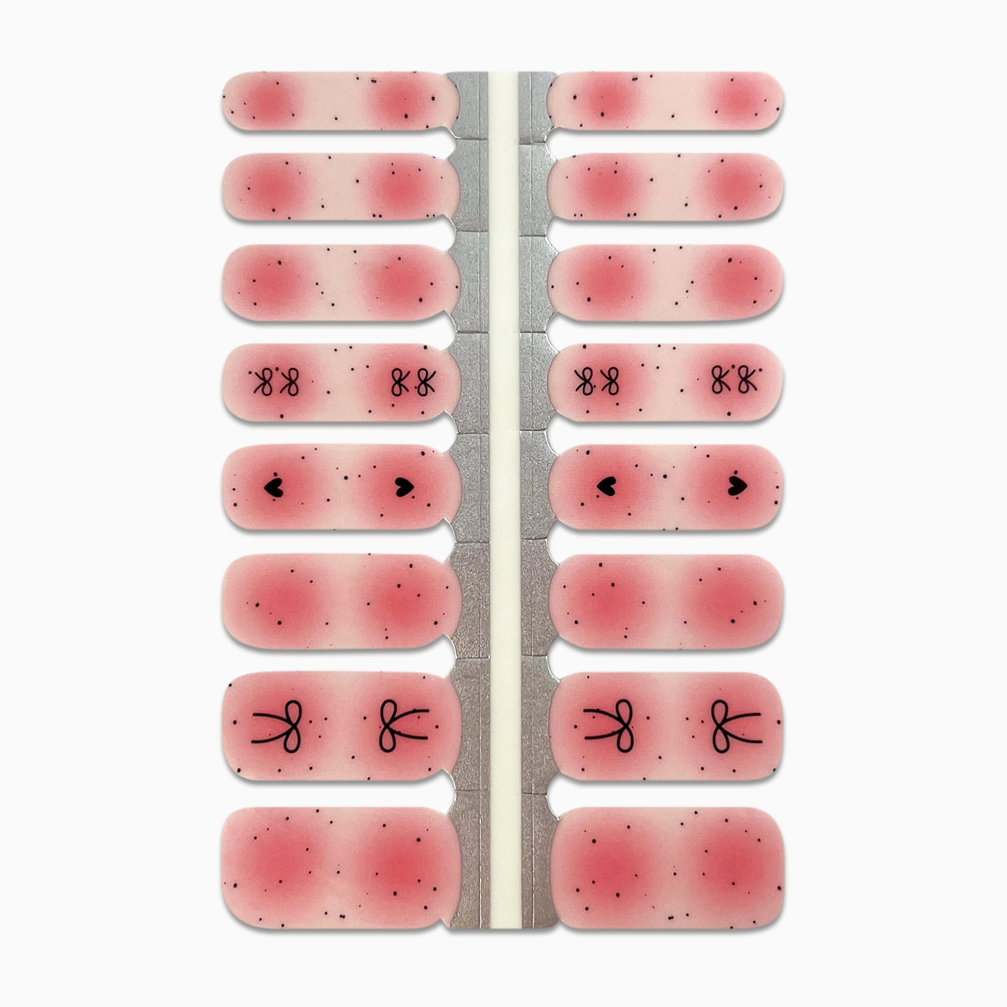 Productfoto van nagelstickers met zwarte stipjes en roze aura op witte achtergrond